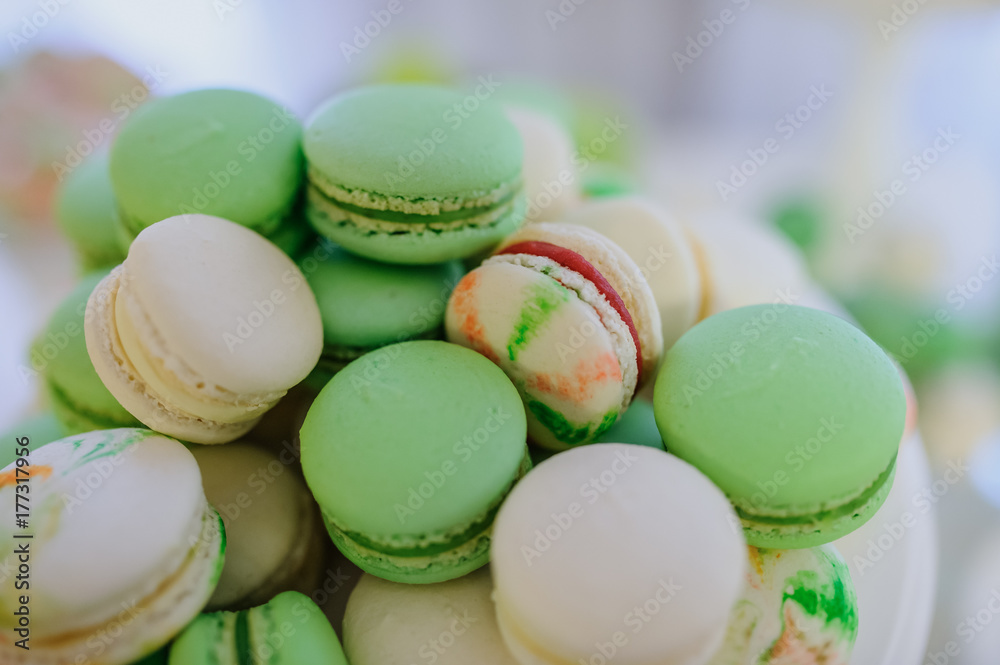 Close up of dessert table with a large macaroons composition Close up of dessert table with a large macaroons composition