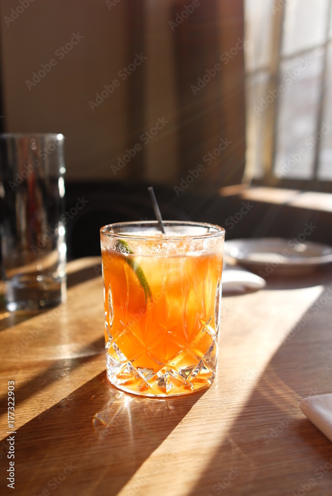 Cocktail in the sunlight on a table