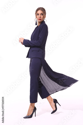 clerk manager business woman in formal pant suit and flaired skirt an stiletto heels shoes isolated on white full body portrait photo