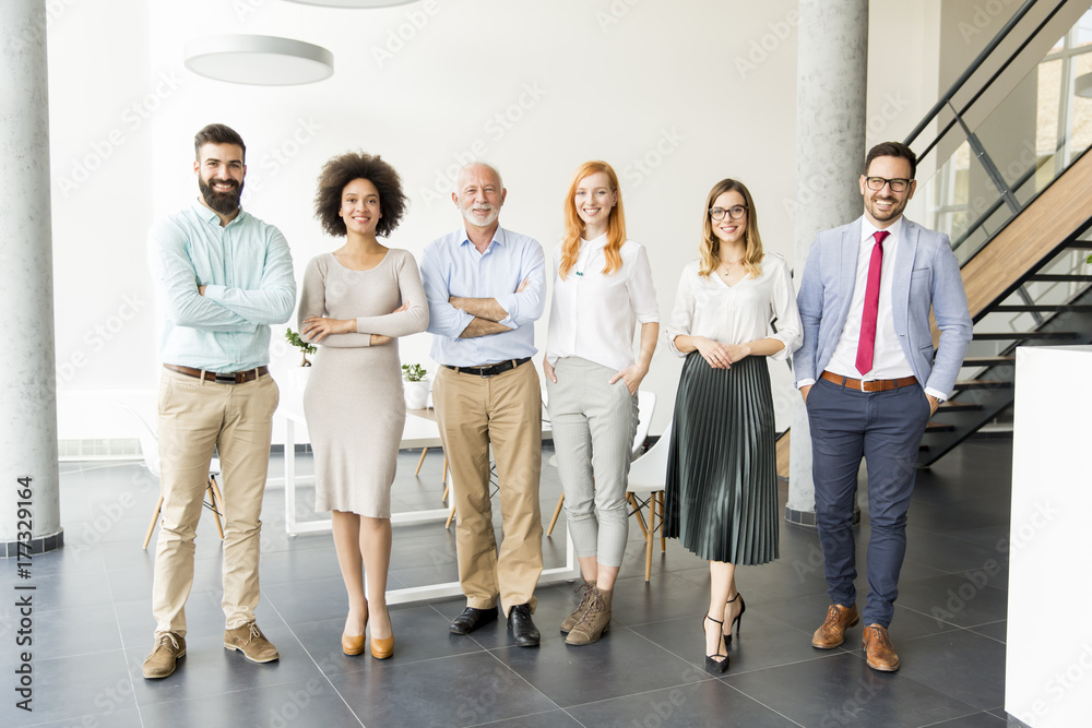 Fototapeta premium Young business people with senior colleague