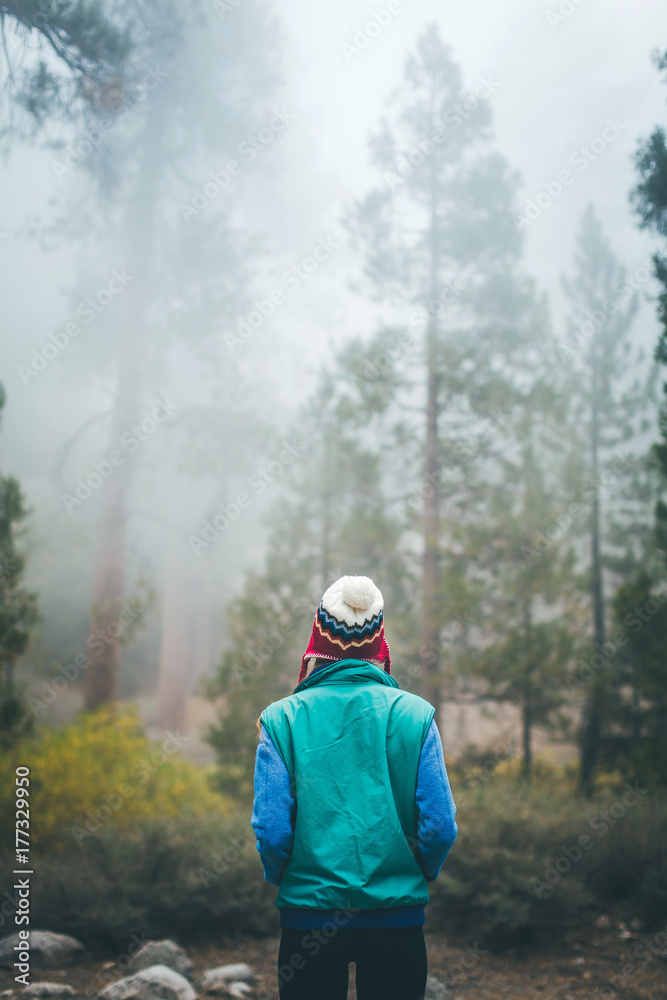 A woman gazing into the forest. A woman gazing into the forest.