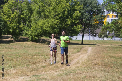 Healthy, fit and sportive couple running in park