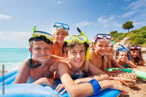 Many kids on the beach at summer vacation