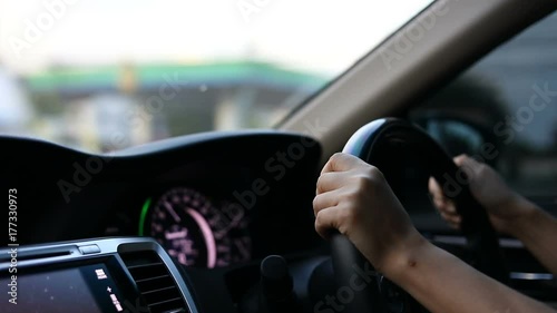 woman hand driver control steering wheel driving vehicle car travel to urban road trips