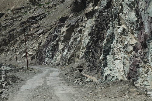 Steep, narrow mountain road with dangerous dropoff photo