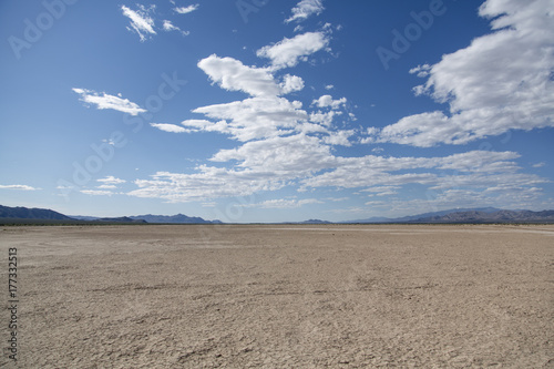Crystal lake bed in the desert with blue skies and clouds