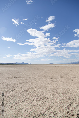 Crystal lake bed in the desert with blue skies and clouds