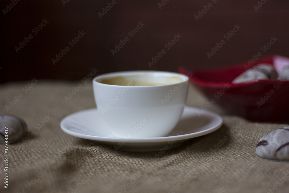 hot cup of coffee with couple of heart shaped chocolate cookies. hot cup of coffee with couple of heart shaped chocolate cookies.