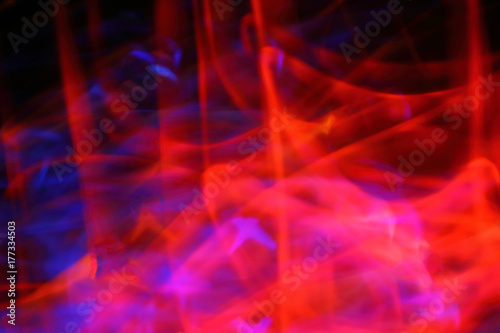 Blurred bright abstraction of a fiery background with colored lines. The constant fiery flame of natural gas, the bright texture brightly burns.