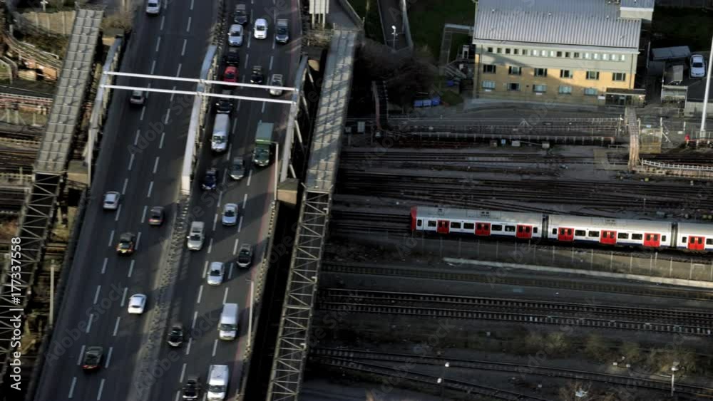  Aerial view of passenger train traveling to a London city station