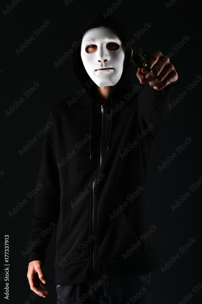 Man in a mask with a gun Man in a mask with a gun