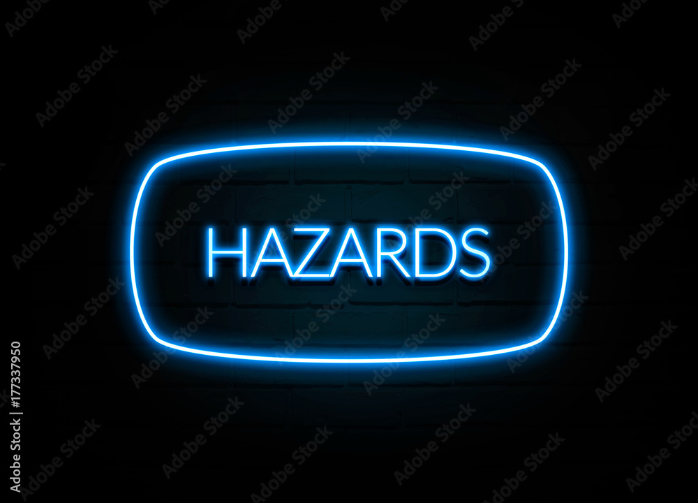 Hazards - colorful Neon Sign on brickwall Hazards - colorful Neon Sign on brickwall