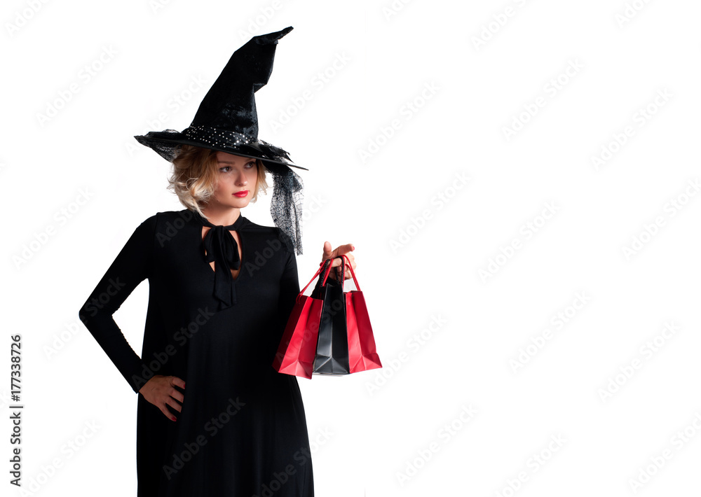 Halloween shopping. Happy woman in witch halloween costume Halloween shopping. Happy woman in witch halloween costume
