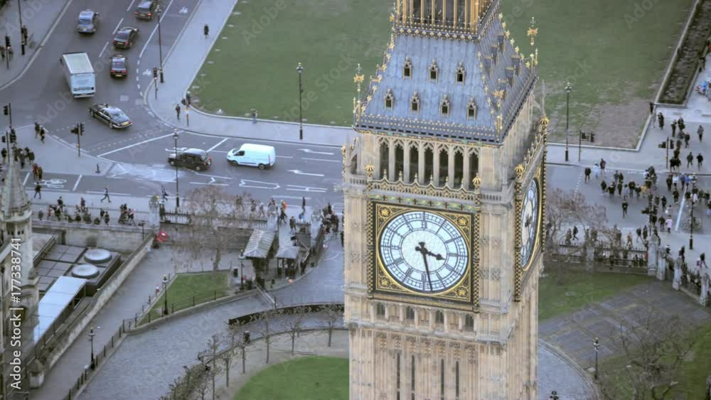  Aerial view above famous landmark Big Ben and Houses of Parliament in London's city of Westminster, situated by the side of the river Thames