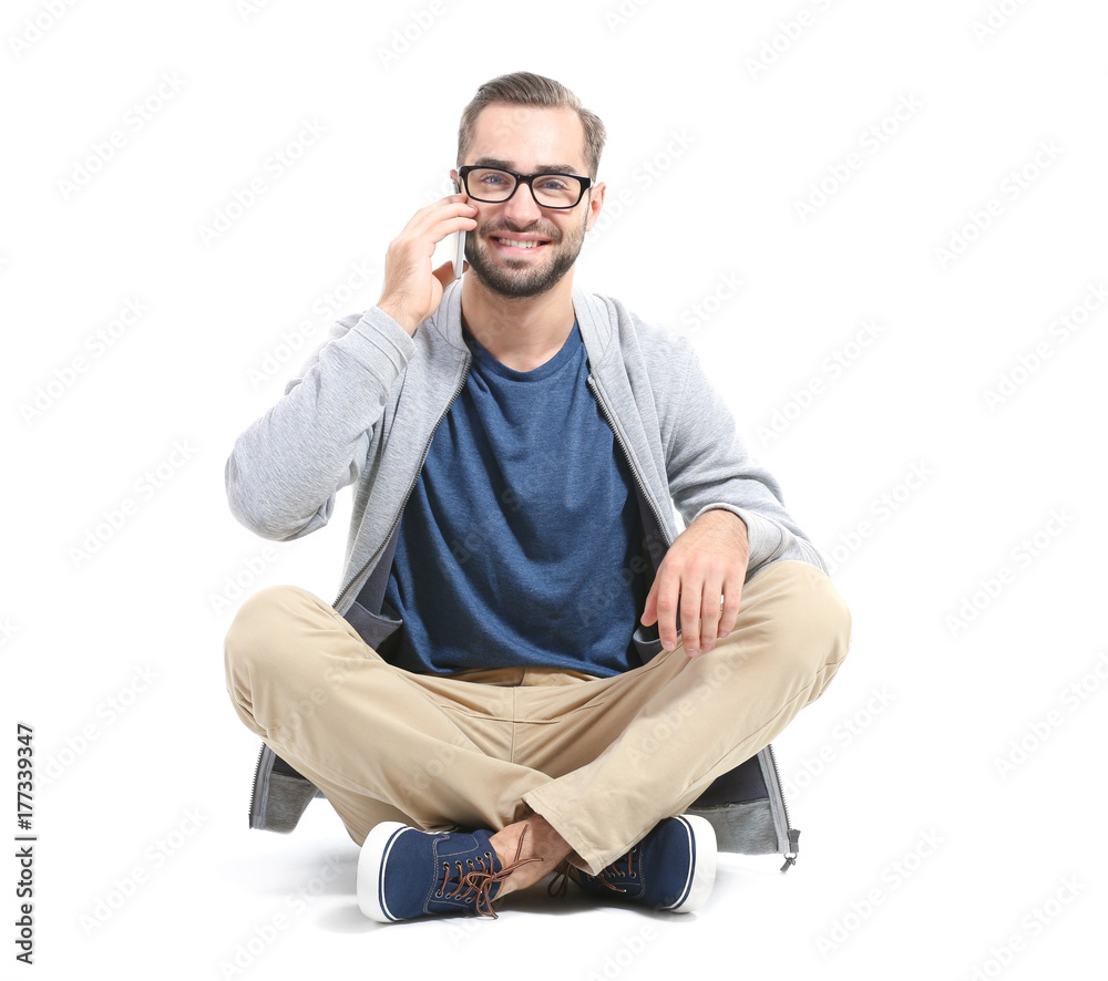 Attractive young man with smartphone on white background Attractive young man with smartphone on white background