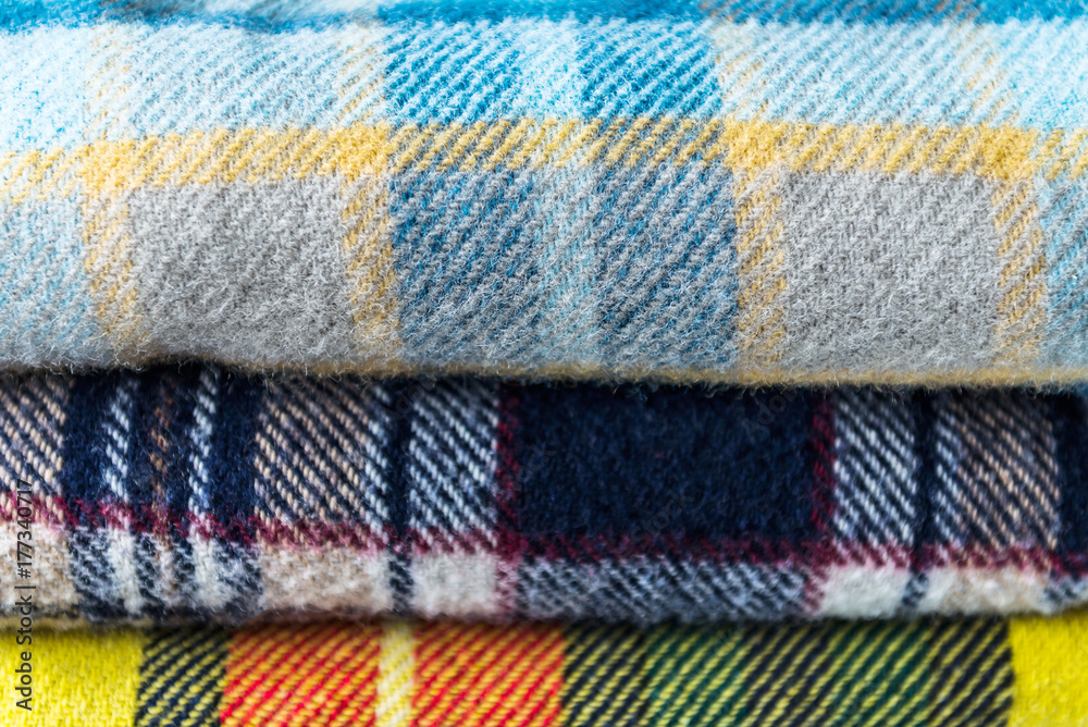 Stack of woolen checked blankets Stack of woolen checked blankets