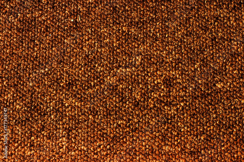 Texture of dense tissue on the carpet of brown