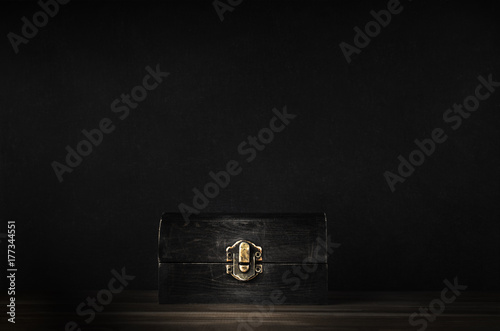 Old Closed Wooden Treasure Chest with Black Background