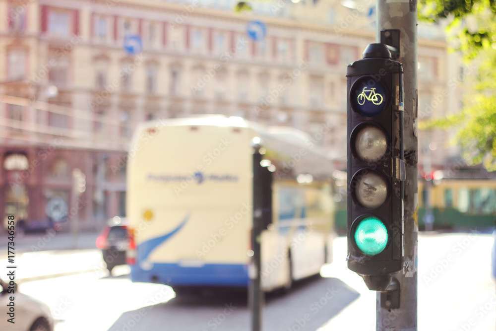 Green light trucks passes through the intersection on a sunny streets of the city Green light trucks passes through the intersection on a sunny streets of the city