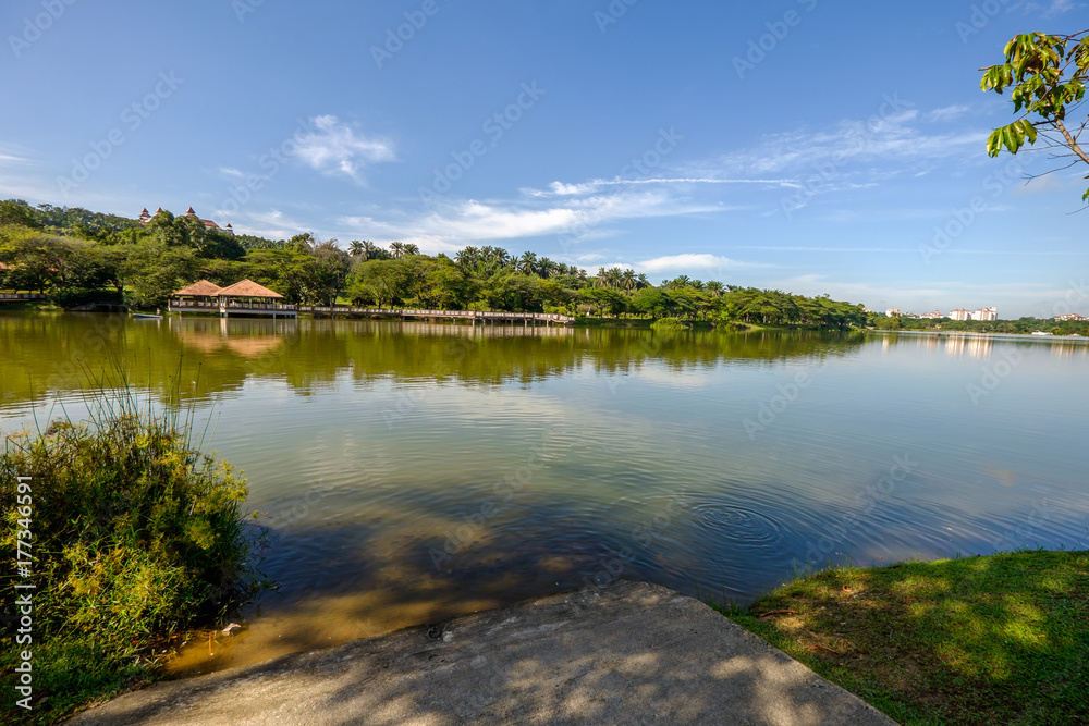 Beautiful view of lakeside water theme park with blue sky at Wetland , Putrajaya Beautiful view of lakeside water theme park with blue sky at Wetland , Putrajaya