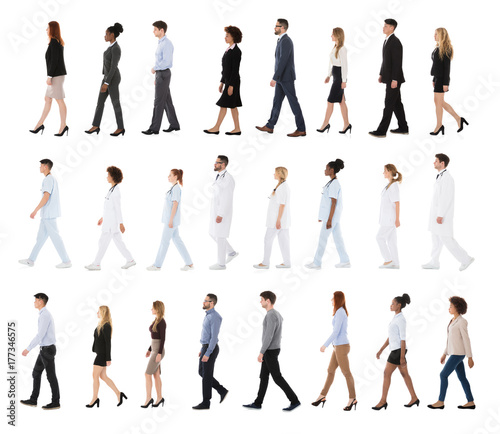 Multiracial Businesspeople Walking In Row