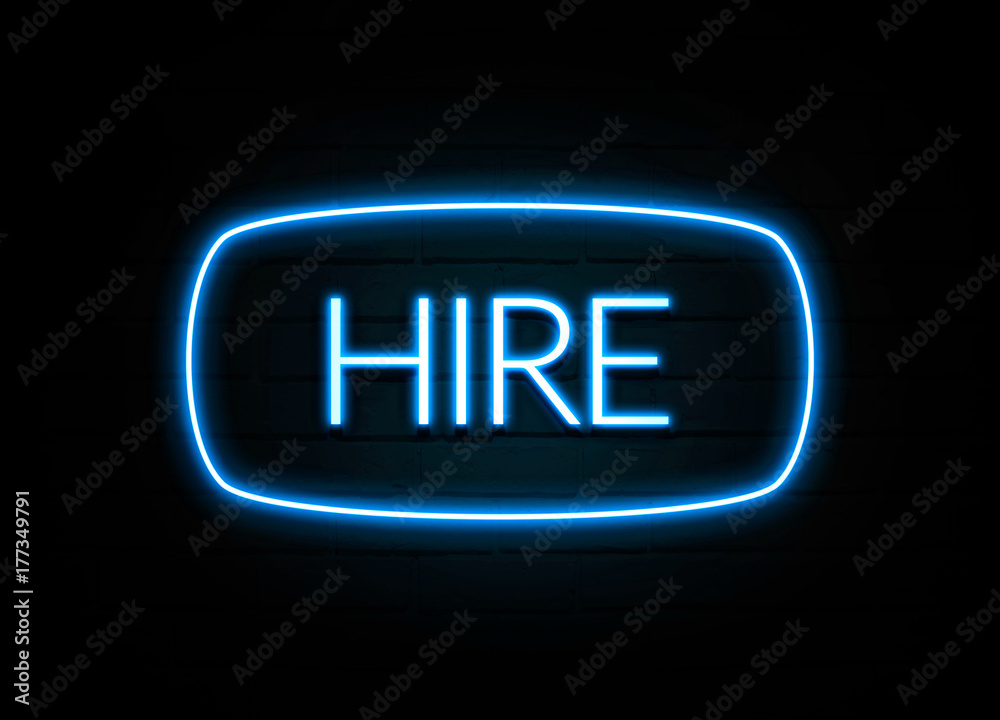 Hire  - colorful Neon Sign on brickwall
