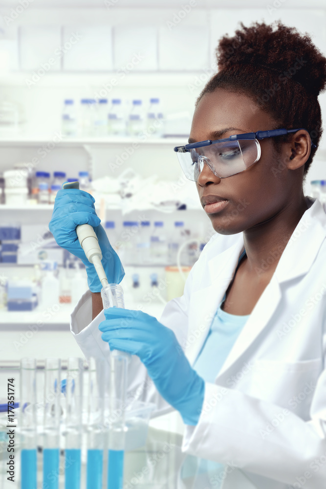African-american scientist or graduate studenт works in the lab African-american scientist or graduate studenт works in the lab