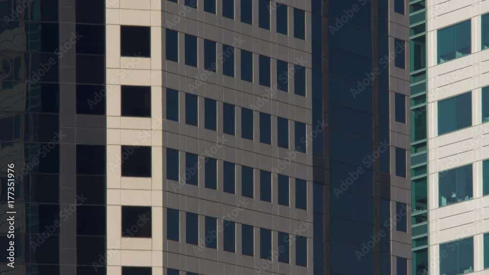 HIGH RISE OFFICE ESTABLISHING SHOT, 4K. Long lens, lock off shot of office windows. HIGH RISE OFFICE ESTABLISHING SHOT, 4K. Long lens, lock off shot of office windows.