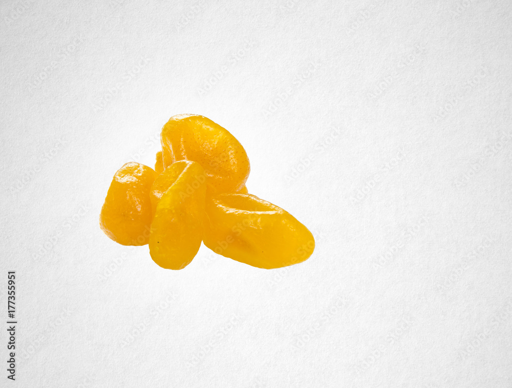 Dried preserved or preserved kumquat on background.