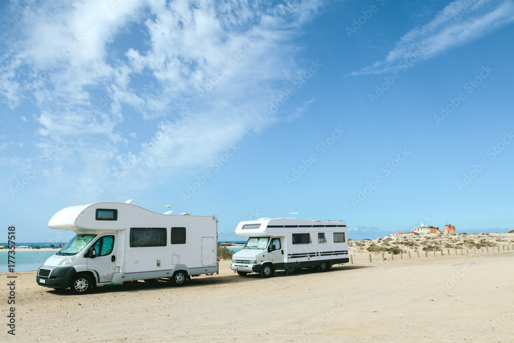 Campers Parked in a Sandy Beach Campers Parked in a Sandy Beach