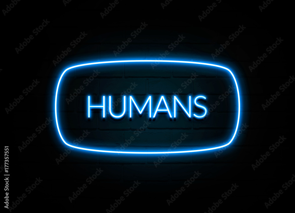 Humans  - colorful Neon Sign on brickwall