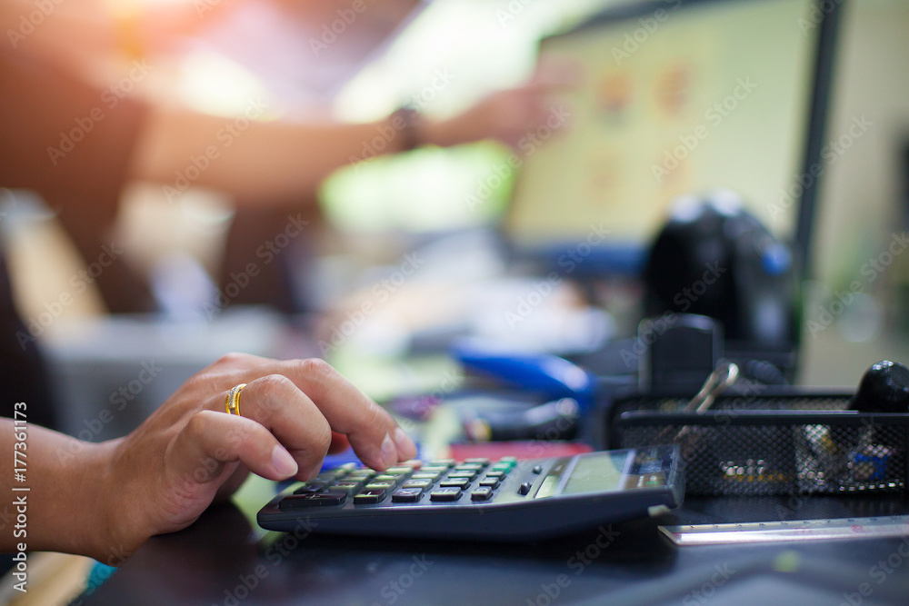 Business man using calculator with doing finance at his office. Business man using calculator with doing finance at his office.