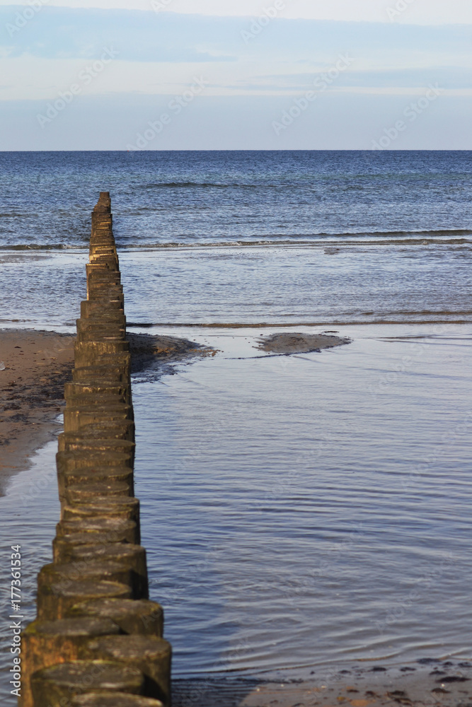 Shot of wooden groins on the island Poel, Baltic Sea, Germany Shot of wooden groins on the island Poel, Baltic Sea, Germany