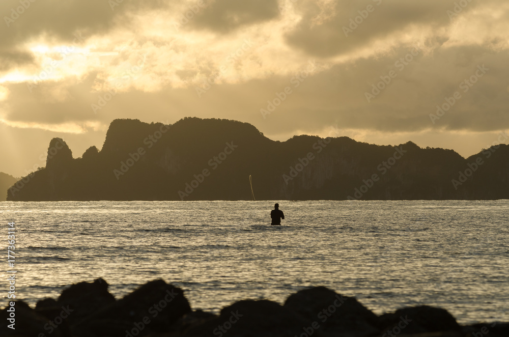 Fototapeta premium Fisherman fishing in the sea at Krabi, Thailand