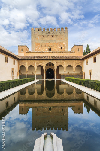 Comares tower reflected in the pond of the Court of the Myrtles photo