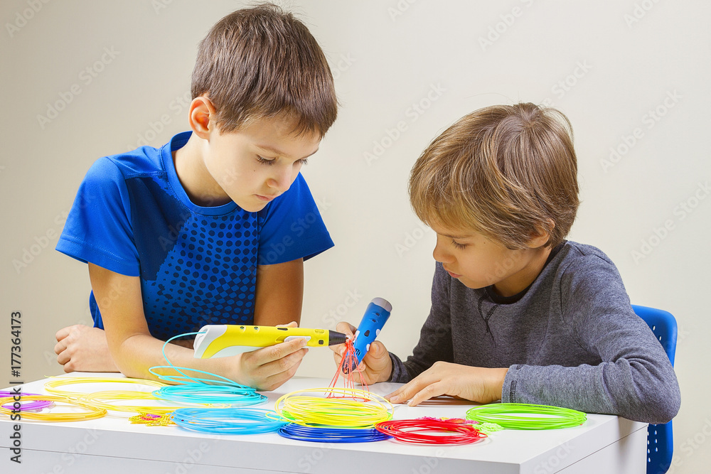 Children creating with 3d printing pen Children creating with 3d printing pen