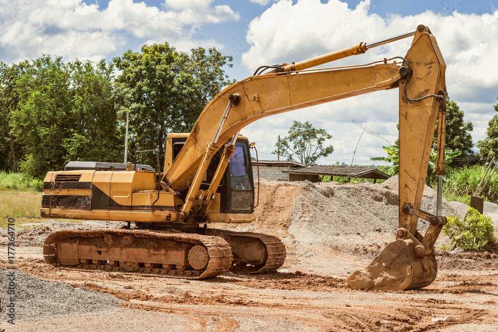 excavator on the workplace construction road at countryside excavator on the workplace construction road at countryside