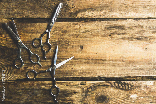 Hair accessories such as scissors On the old wood desk in a professional hairdresser from above, the text area. Vintage Ideas