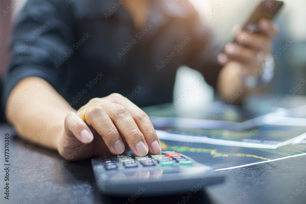 Business man using calculator with doing finance at his office. Business man using calculator with doing finance at his office.