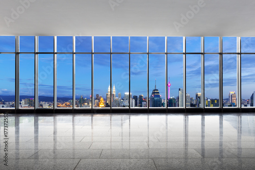Canvas Print empty office with cityscape of kuala lumpur at twilight