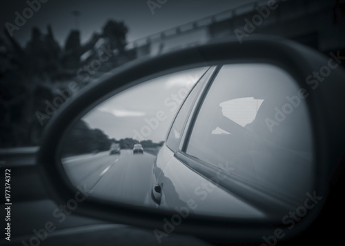 Unusual view of the highway from reflection on rearview