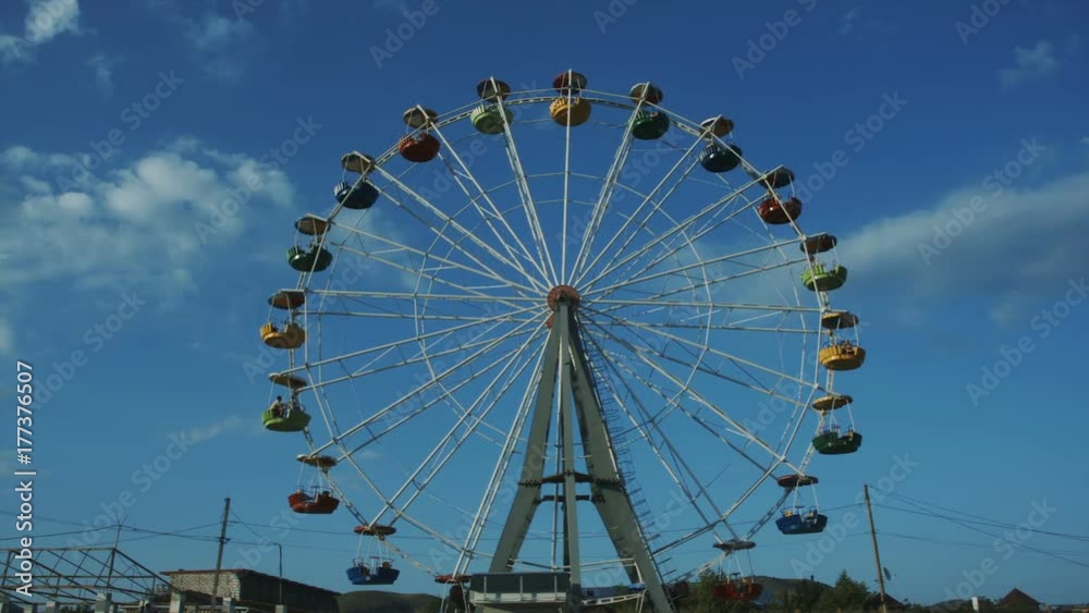 A huge merry-go-round in an amusement park A huge merry-go-round in an amusement park