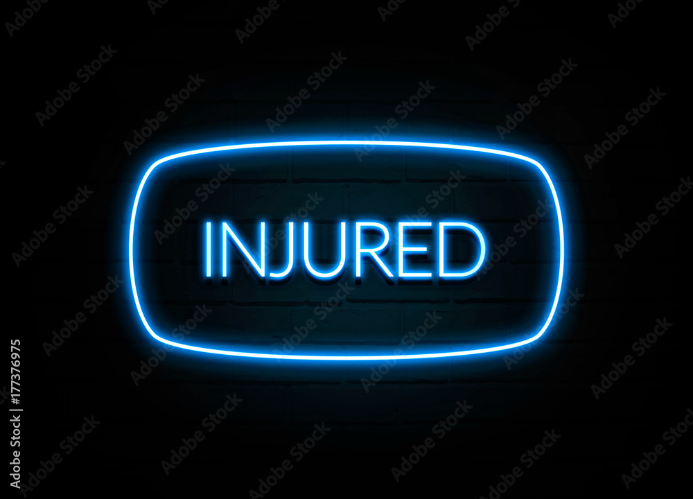 Injured - colorful Neon Sign on brickwall Injured - colorful Neon Sign on brickwall