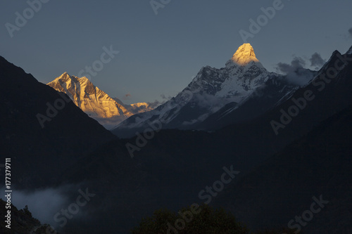 Mt. Amadablam,6,812 metres to the right and Mt. Lhotse,8516m to the left gleaming on the evening sun photo