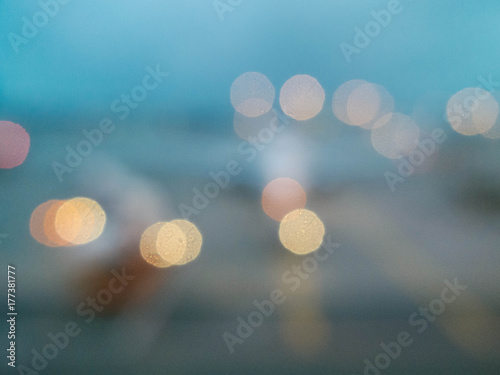 Bokeh out of focus lights looking out at airplane on runway photo