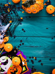 Halloween party symbol decorations frame - pumpkins, sweets, skeletons, spiders, web, dark confetti. Holiday invitation frame