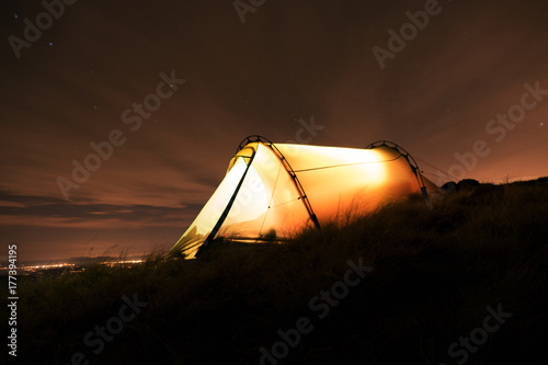 long exposure of a tent in the swiss alps