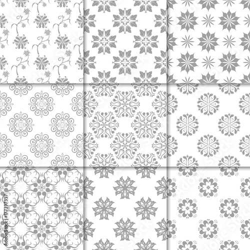 Gray and white floral ornaments. Collection of seamless patterns