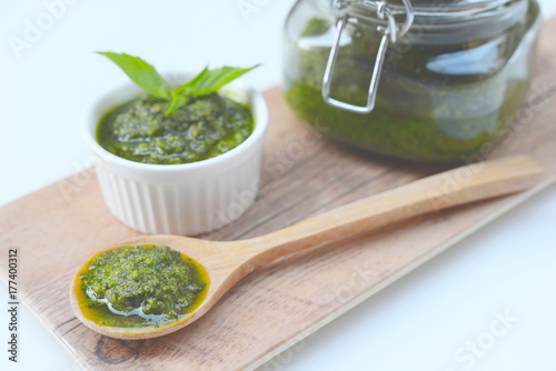 homemade pesto sauce in a jar with pine nuts parmesan and garlic