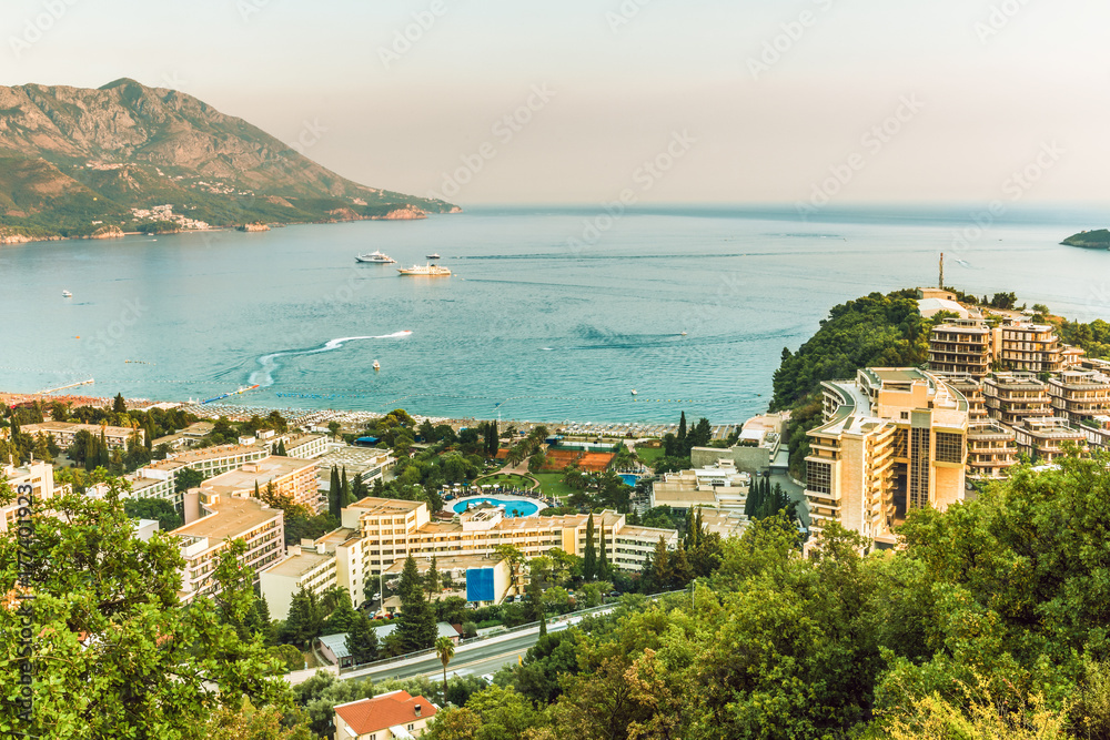 View of the hotels and the crowded beaches of the resort town of Becici, Budva Riviera, Montenegro.